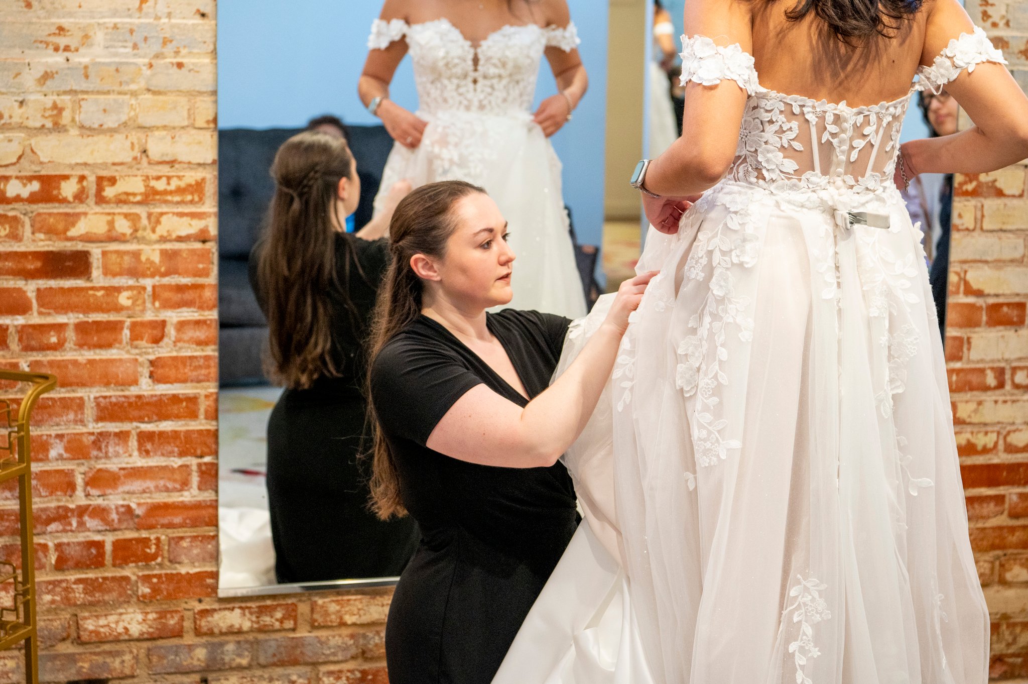 Bride working with her bridal stylist during a private appointment at Bliss Bridal Salon