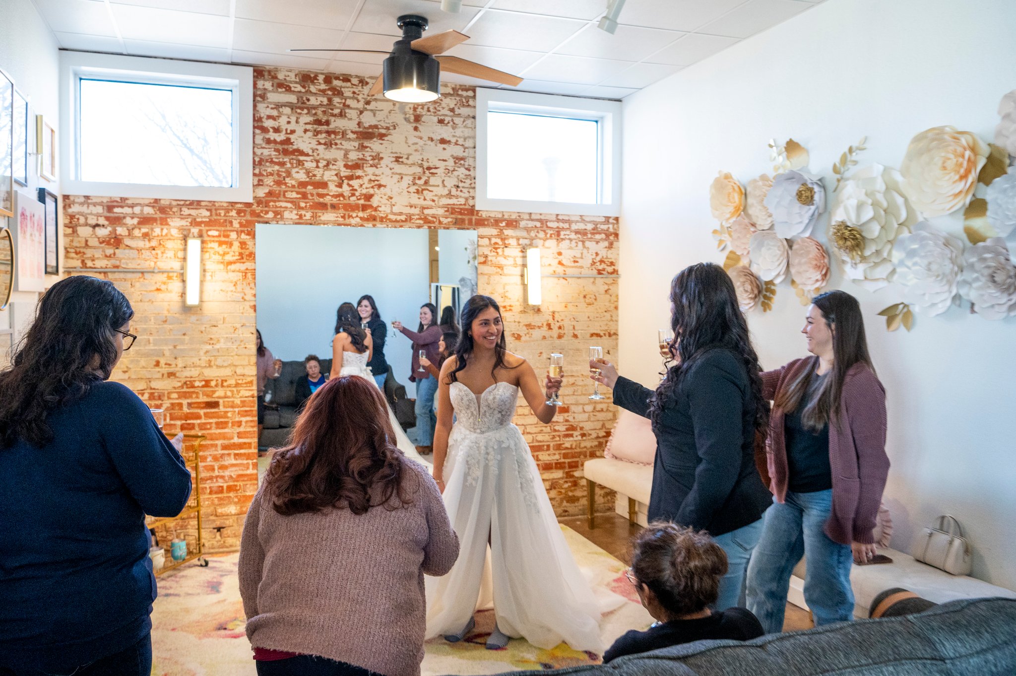 Bride celebrating her yes moment with her guests at Bliss Bridal Salon