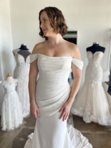 Crepe off the shoulder wedding dress in Fort Worth Bridal Shop
