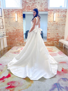 High neck low back with bow accent a-line mikado wedding dress by Haley Mai Bridal