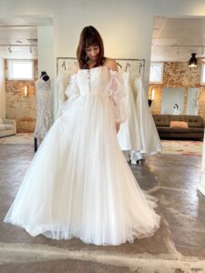Stella York 7573 off the shoulder bishop sleeve a-line wedding dress in fort worth bridal shop