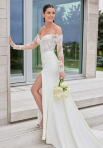 Soraya wedding dress by Morilee featuring a beaded lace corset bodice with basque waist and sleek crepe fit and flare skirt