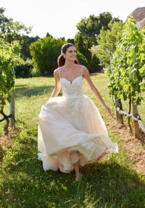 Morilee Sim wedding dress style 2732 featuring a modified sweetheart neckline, beaded 3D floral lace appliqués, and layered tulle over Chantilly lace