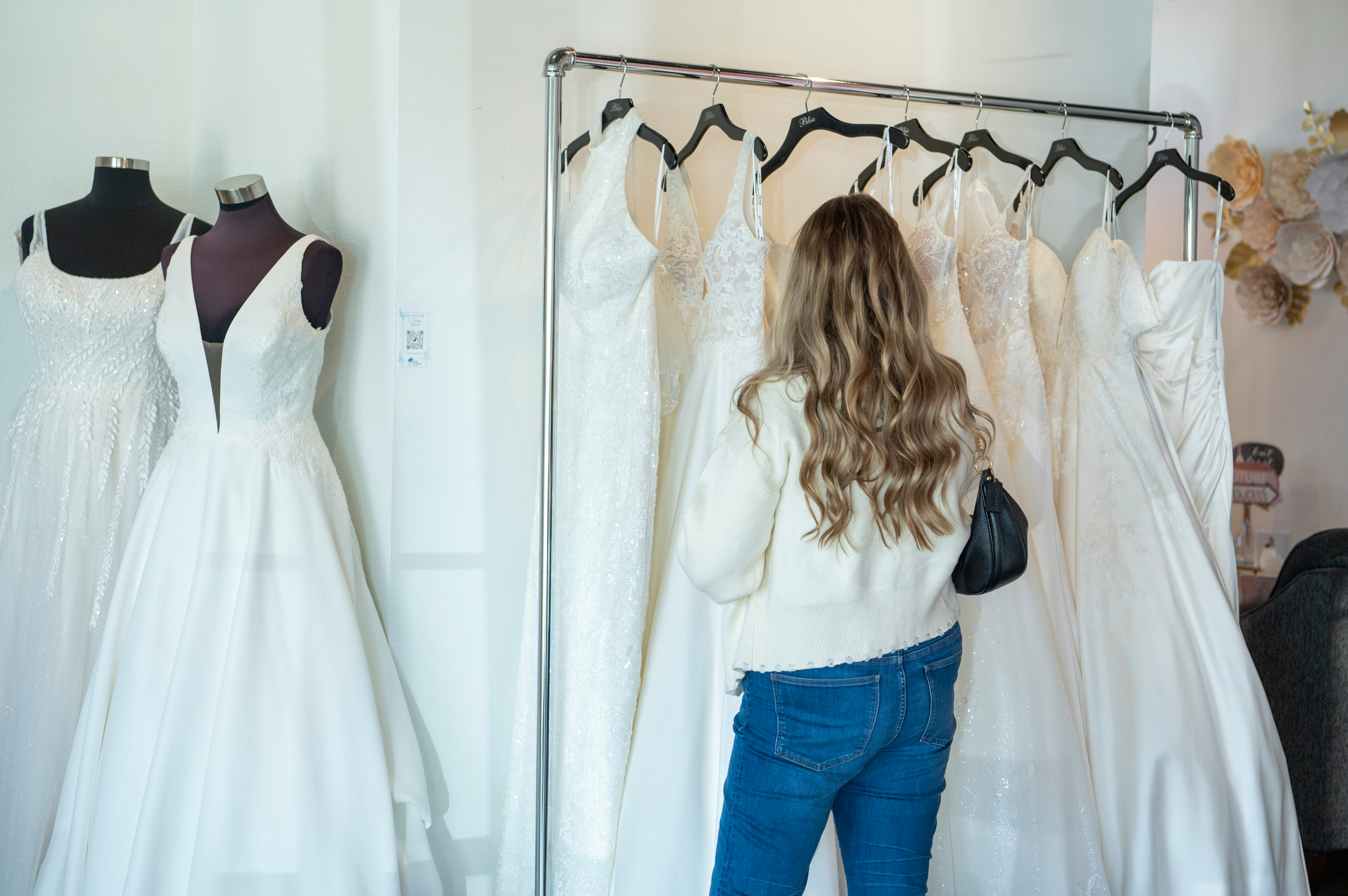 Bride shopping designer wedding gowns during National Bridal Sale Week at Bliss Bridal Salon